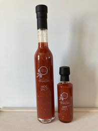 Hot spicy tomato and basil vinegar, available in small and medium sizes. Features a rich, red color and a bold, zesty flavor profile.