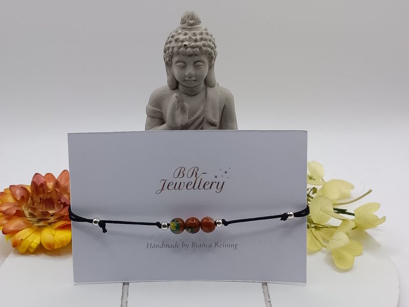 Bracciale con pietre preziose a flusso d'oro