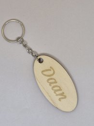 Personalized boy name keychain, oval wooden tag, engraved text, metal ring attachment