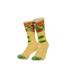 Yellow socks with colorful flowers, green toe and heel, fun silly design, vibrant floral pattern.