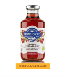 Organic pomegranate and berry juice, 500 ml bottle with vibrant red color and pomegranate seeds visible.
