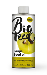 Grape seed oil bottle, clear liquid, yellow-green tint, cooking oil, 500ml container, culinary ingredient.