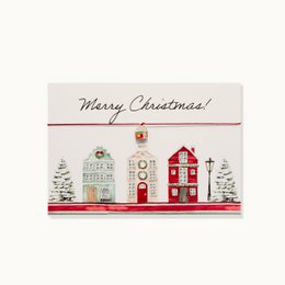 Merry Christmas card with festive houses, trees, red and white holiday design, seasonal greeting.