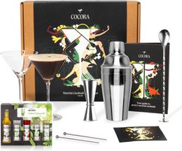 8-piece mocktail set with V-shaped glasses, cocktail shaker, and bar tools. Includes ingredients for making non-alcoholic cocktails.
