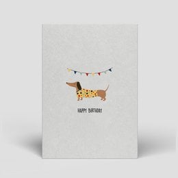 Colorful, eco-friendly birthday card with layered stripes in shades of blue, green, and orange.