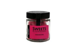 Strawberry-flavored bonbons in a glass jar with a black lid. The bonbons are a vibrant pink color and the jar is labeled "Sweets by heidelbonbon".