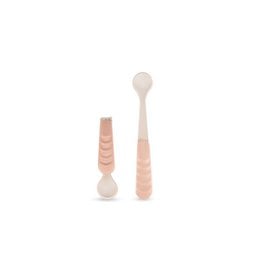 A set of pink and white infant spoons with a soft, rounded design, suitable for feeding young children.