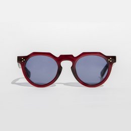 Burgundy-colored round sunglasses with a modern, stylish design.