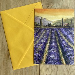 Lavender field postcard with a scenic landscape of rolling hills, mountains, and a vibrant purple lavender field in the foreground.