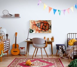 Vibrant abstract wall art featuring an orange and black fish-like shape with expressive brushstrokes and a playful, artistic style.