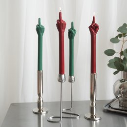 Tall taper candles with middle finger gesture shape, available in burgundy, green, grey, pink colors.