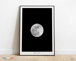 A black and white poster featuring a detailed image of the full moon against a dark background. The poster is suitable for wall art or home decor.