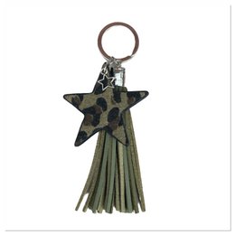 Olive green leather keychain with a star-shaped charm and tassel. Made of durable materials, suitable for holding keys or as a decorative accessory.