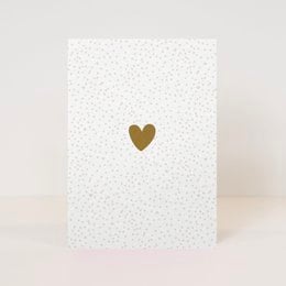 A simple white postcard with a gold heart in the center, conveying a message of love and friendship.