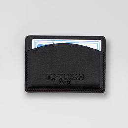 Black leather card holder with minimalist design. Suitable for storing credit cards, ID, and other small items. Compact and portable for everyday use.