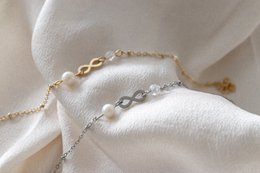 Infinity & Parel Armband - Goud