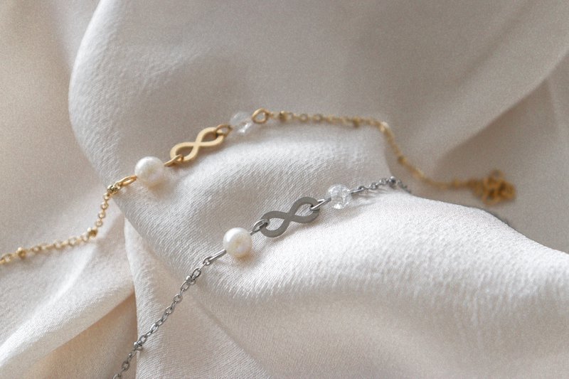 Infinity & Parel Armband - Goud