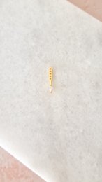 Gold bar stud earrings, minimalist linear design, delicate statement piece, lightweight everyday wear.