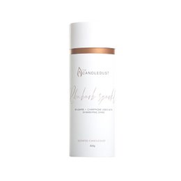 Rhubarb sparkle 650g - Gift Tube, a scented candle with a cylindrical shape, white color, and a copper-colored lid. The candle has a rhubarb and champagne fragrance.
