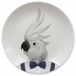  "Decorative plate featuring a cockatoo wearing a bow tie, suitable for kids' dinnerware. The plate has a round shape and a monochrome design with the cockatoo image."