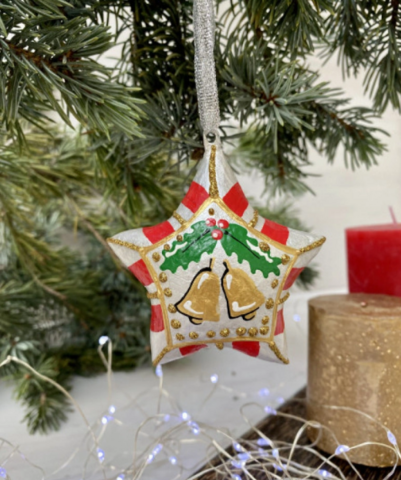 Handmade papier-mache star with Christmas flower