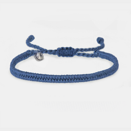 Navy blue braided bangle bracelet with adjustable cord and metal charm.