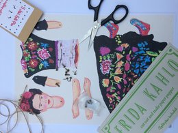 Vibrant floral-patterned dress and top with Frida Kahlo-inspired design, featuring bold colors, intricate embroidery, and a playful, artistic aesthetic.