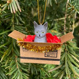 Handmade grey cat Christmas ornament in a mini box, with a gold chain for hanging.