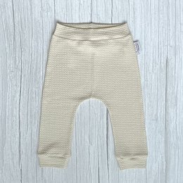 Beige harem pants with a wavy natural pattern, suitable for babies. The pants are available in sizes 56 to 116 cm.