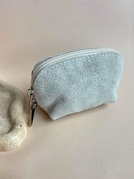 # LOLA MINI PURSE
Light blue wool felt cosmetic pouch, fuchsia pink wool felt small bag, soft fuzzy texture, compact curved shape, zipper closure.