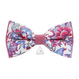 Floral and animal print bow tie with coral accents, suitable for formal or casual wear.