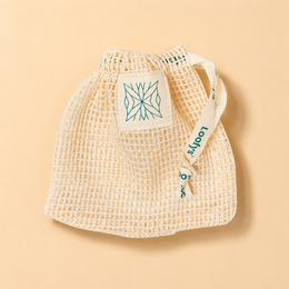 White soap pouch with a cord, made of natural materials.