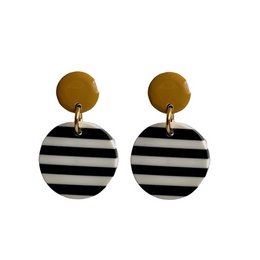 Stud earrings with black and white striped circular pendants and gold-tone posts.