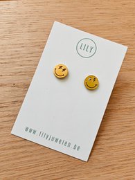 Gold-tone stud earrings with smiley face design.