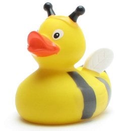 A yellow rubber duck toy with black antennae and wings, designed for use in the bath or shower. The duck has a friendly, cartoon-like appearance.