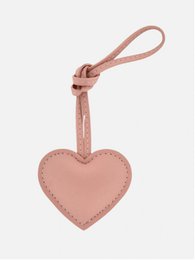  Blue, pink, black, and blue heart-shaped bag charm with a carabiner clip.