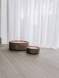  Luxe, durable taupe-colored concrete scented candle in XL size. Features a round, cylindrical shape with a metal accent.