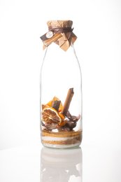 Preparation for arranged rum "Orange Lemon Passion" 1 L. Glass bottle filled with orange and lemon slices, cinnamon sticks, and other spices. Label on bottle reads "Dates Meisses".