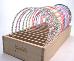 YUKO B HEADBAND OFFER. Wooden display including the entire collection of headbands, 2 per model and 34 in total