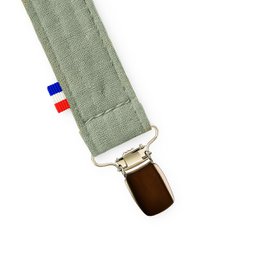 Organic cotton teddy bear pacifier clip in green color.