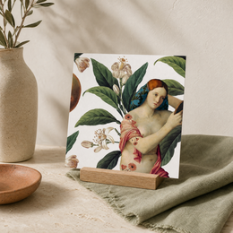 A postcard featuring a colorful, artistic illustration of a woman surrounded by lush, tropical foliage and flowers. The image has a vintage, botanical feel with vibrant colors and intricate details.