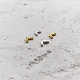 Two-tone angle stud earrings in a variety of metallic colors.