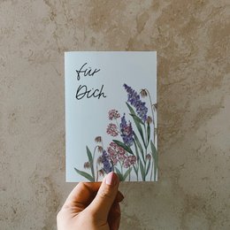 Postcard with colorful wildflowers, made of recycled paper. Features a floral design with purple and pink flowers.