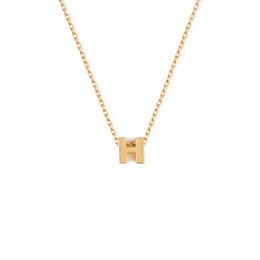 Gold-toned pendant necklace with the initial 'H' charm.