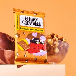 Creamy hazelnut chocolate snack bars in a colorful package featuring a cartoon character. The product is a multi-pack of 10 individually wrapped bars.