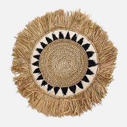 Round woven wall decor with black and white geometric pattern, made of natural straw material.
