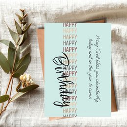 A Christian birthday card with the text "May God bless you abundantly today and in the year to come" written in a cursive font against a background of the word "Happy Birthday" repeated in various colors.
