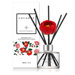 Camellia-scented reed diffuser in 200ml and 120ml sizes, available in Black Cherry, White Musk, and Lovely Peony fragrances. Elegant glass bottle with decorative reeds.