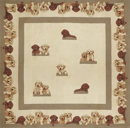 Beige throw blanket with a repeating pattern of Labrador puppies in various poses. The border features additional Labrador puppy illustrations in shades of brown.