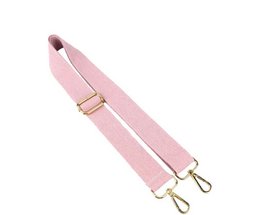 A pink makeup pouch with a signature strap and gold-tone hardware.